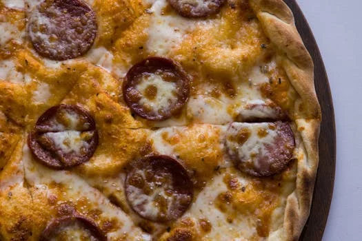 pepperoni pizza melted cheese golden crust